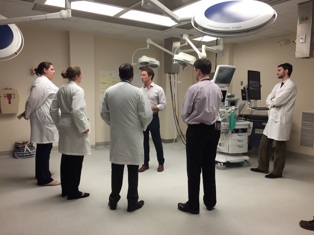 Early Arena Labs photo with founder, Brian Ferguson, with a group of physicians